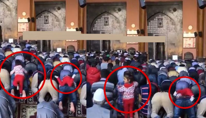 girl child climbs her fathers shoulder during namaz video goes viral