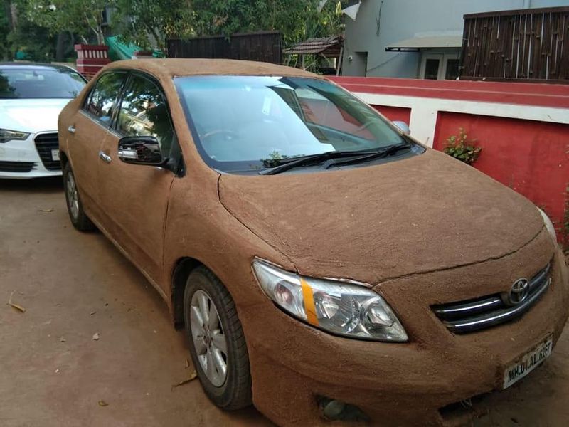 Toyota Corolla Altis car pasted with cow dung to avoid summer heat