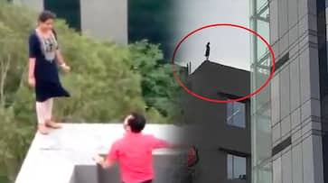 Women working in MNC climbed on building after fired from job in Haryana Gurugram