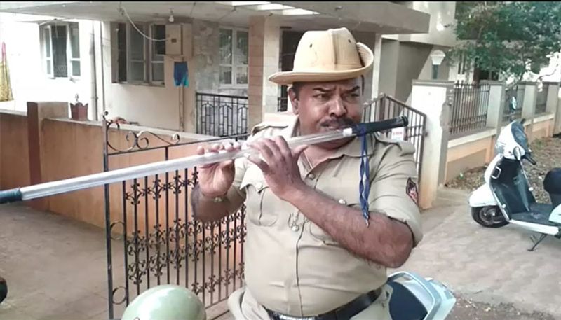 video of constable who plays flute out of a lathi goes viral