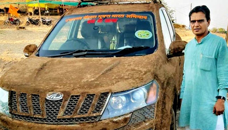 Doctor coats his Mahindra XUV500 with cow dung to cool it