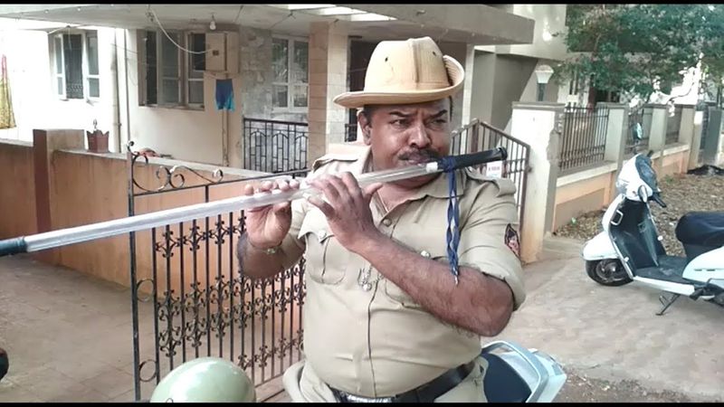 Karnataka police head constable Chandrakanth baton into flute