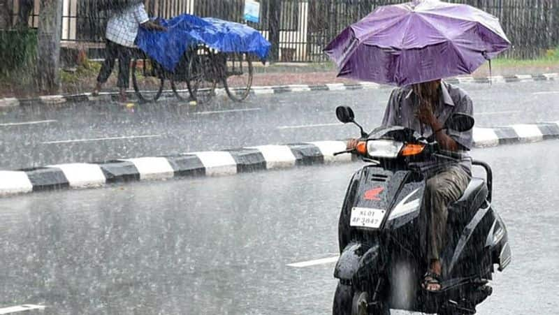 Dangerous of opening umbrella while travelling on two wheeler