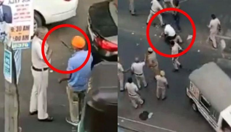 driver attacks policeman with sword police beating him brutally