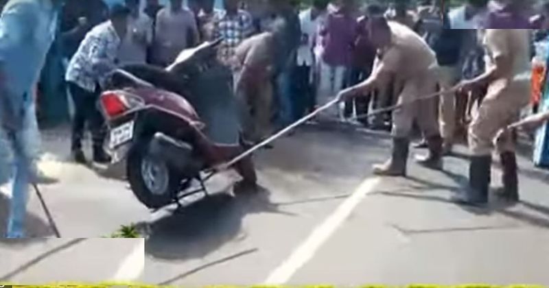 cobra snake rest inside a Honda Activa when it spotted by the rider on the road