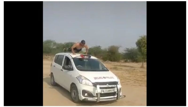 video of youth doing exercise on delhi police vehicle, goes viral