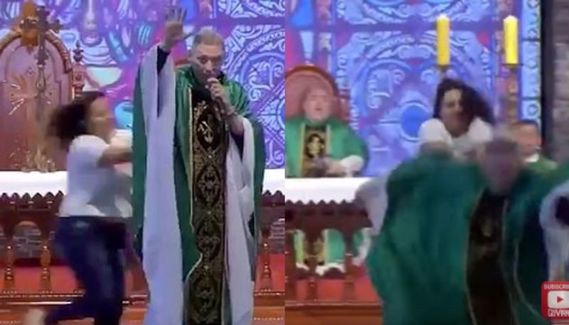 woman shoves priest off stage saying fat women dont go heaven