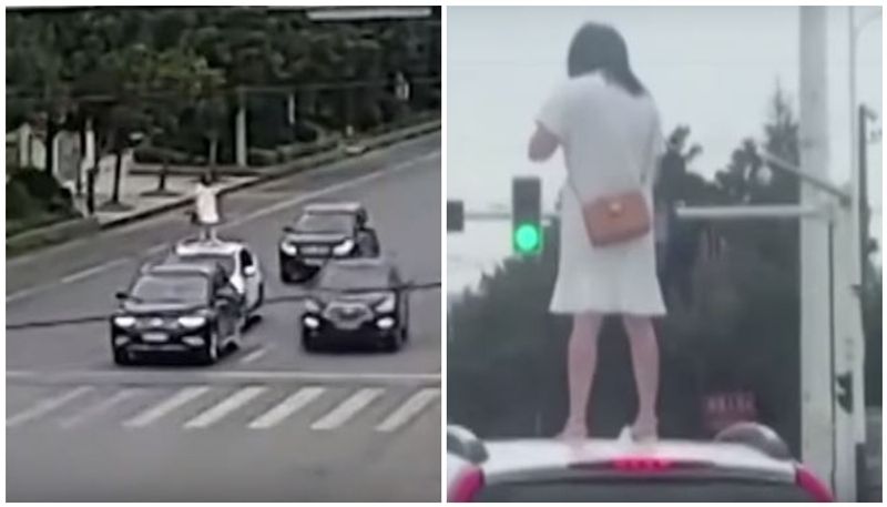 women climbs onto car roof after argument with husband