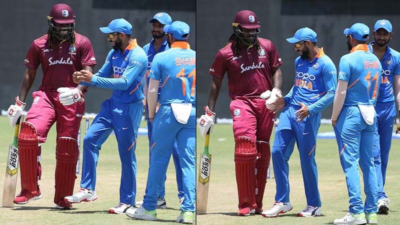 Team India Cricket Captain Virat Kohli dances with Chris Gayle during rain break in 1st ODI