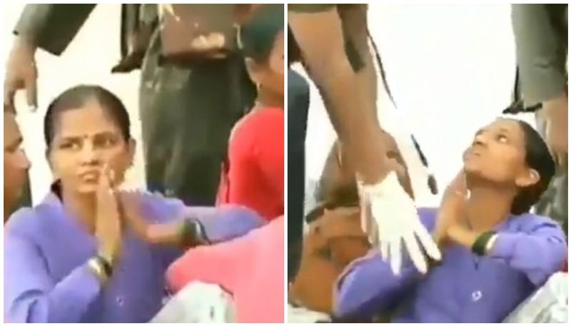 woman touching soldiers feet for rescuing them-video