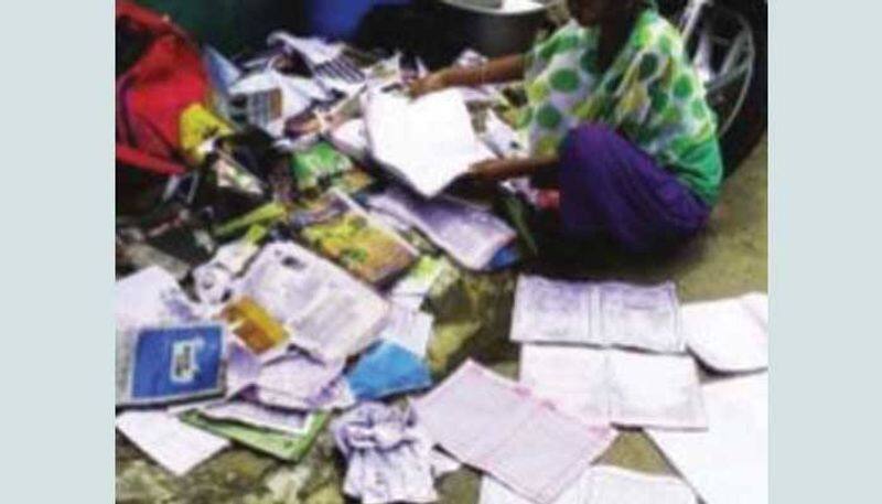 Shivamogga girl breaksdown after her school book lost in flood water