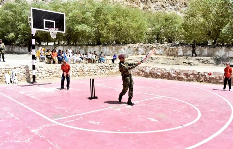 lieutenant colonel ms dhoni plays cricket with leh kids during Indian army service