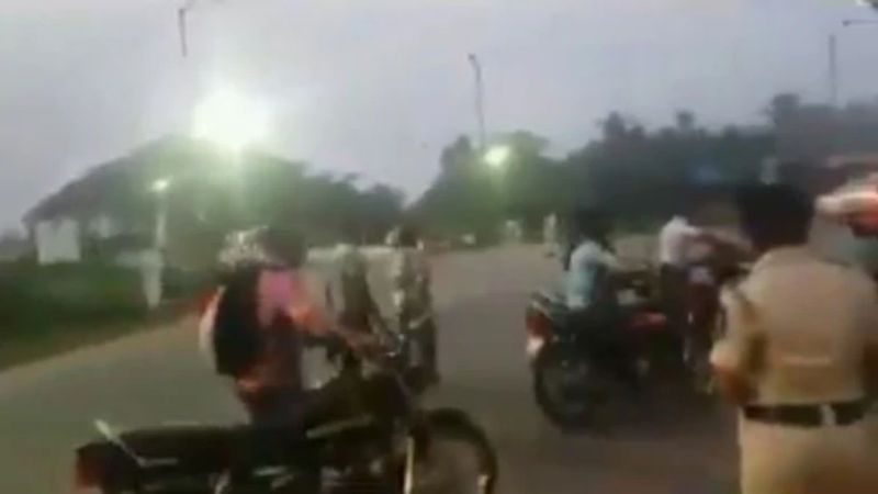 Viral video Avoid traffic fine bikers walk with two wheelers in front of cops