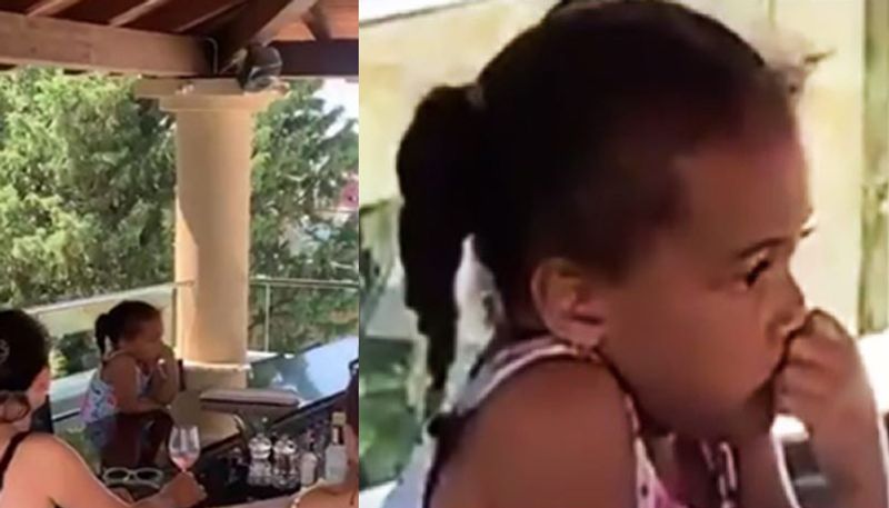 three Year Old Girl Sidles Up to Resort Bar to Order a Glass of Milk on Vacation