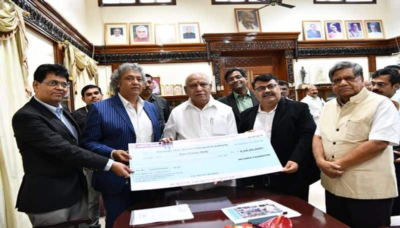 Karnataka Floods Jio and Reliance Retail hand over 5 Crores to CM Relief Fund