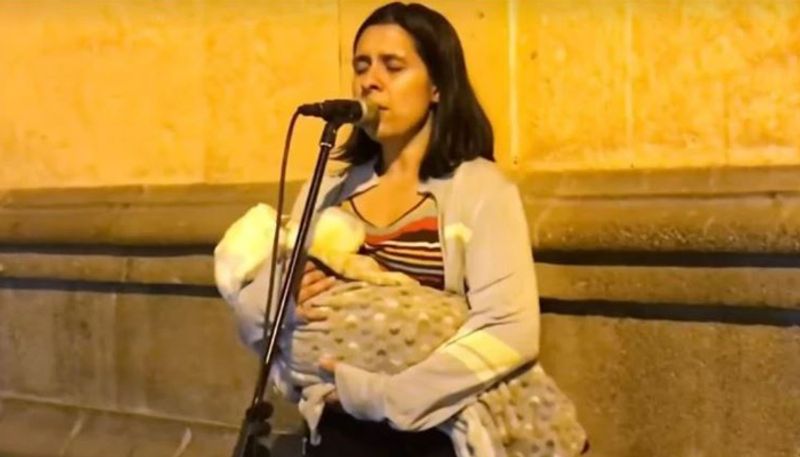 Venezuelan refugee mom sings on Peru streets while cradling her baby