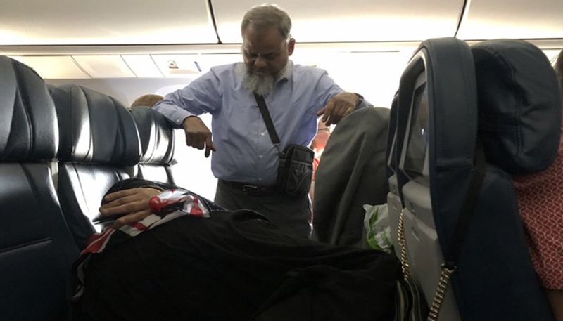 man stands in flight for six hours to let wife peacefully, social media divided over photo