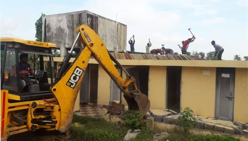 .dismantle illegal building at tulluru