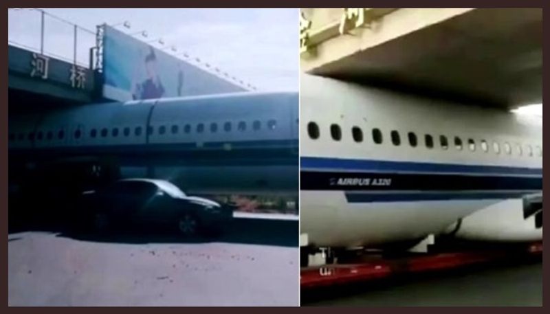 airplane was stuck under a footbridge in Harbin China