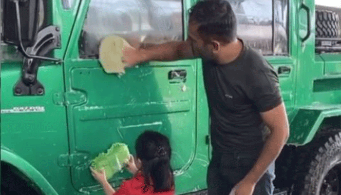 MS Dhoni And Daughter Ziva Clean His New Car Together Video goes Viral