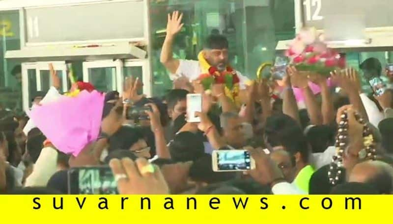 Congress leader DK Shivakumar welcomed by supporters at Bengaluru airport