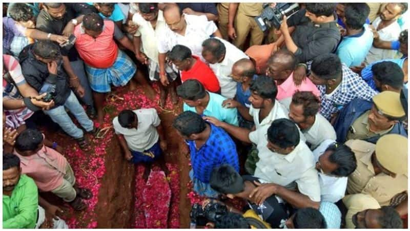 taken by selfie ... pose for camera while burying Surjit