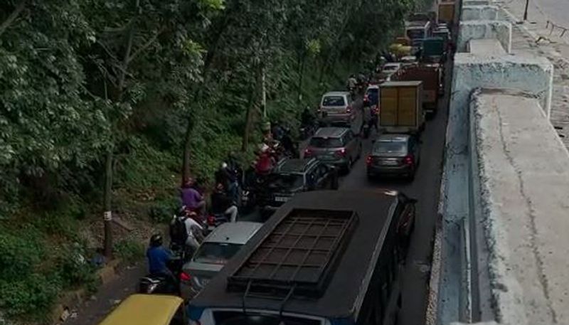 Traffic congestion due to potholes on Sumanahalli flyover