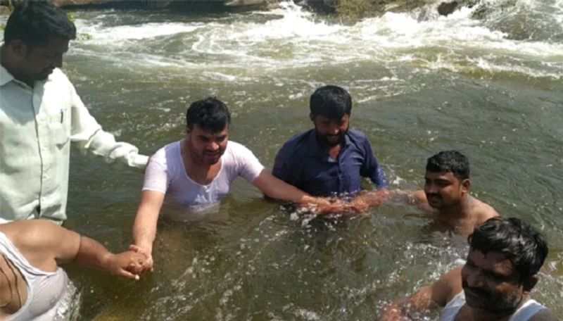 kunigal mla ranganath swims in  Markonahalli Dam