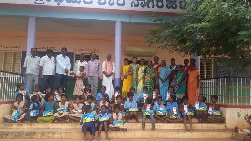 A teacher sells books door to door to popularize kannada language