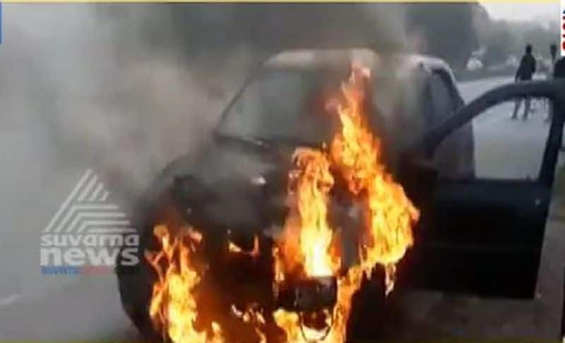 Renault logan car catches fire at nice road bengauluru