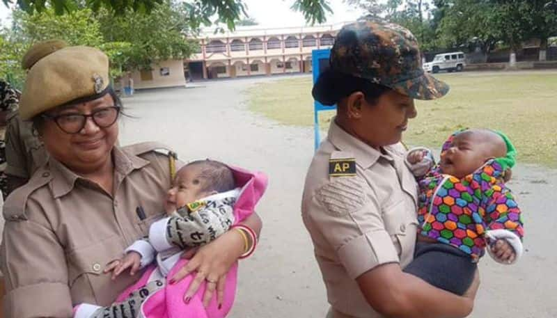 women police officers took care of babies