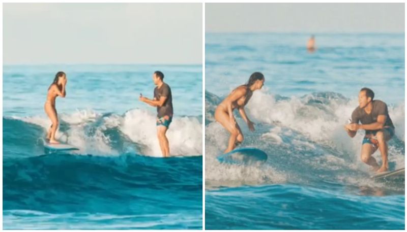 Man proposes girlfriend while surfing