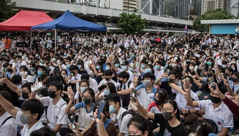 Several Hong Kong protesters surrender as police cordon off campus