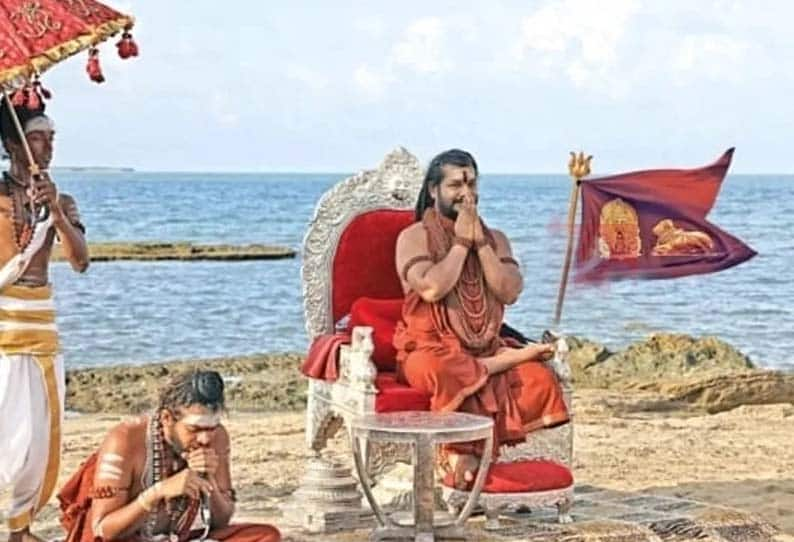 nithiyananda photo printed in marriage banner