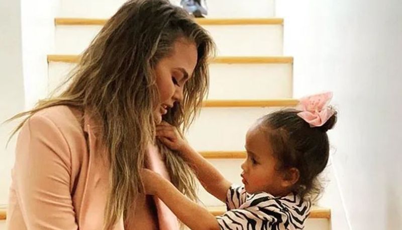 model Chrissy Teigen gives it back to troll who asked her to breast cover up