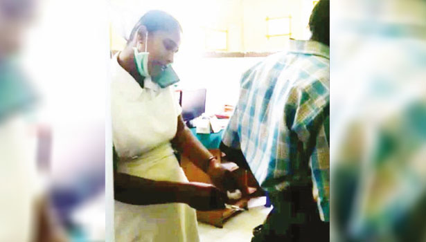 nurse put injection to a patient by speaking in cell phone