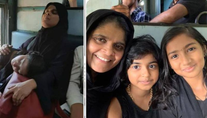 behind the photo of a girl sleeping in a muslim woman's lap in a train