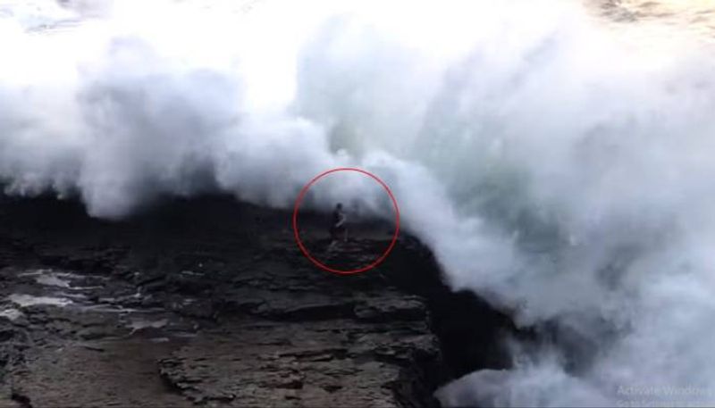 a Huge Wave Sweep Beachgoer Into Ocean