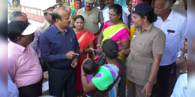 district collector questioned a woman who begged with a child