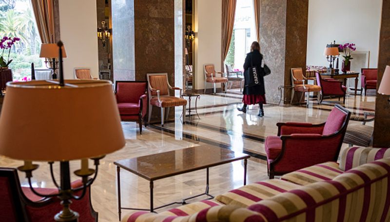 Elephant casually strolls in hotel lobby