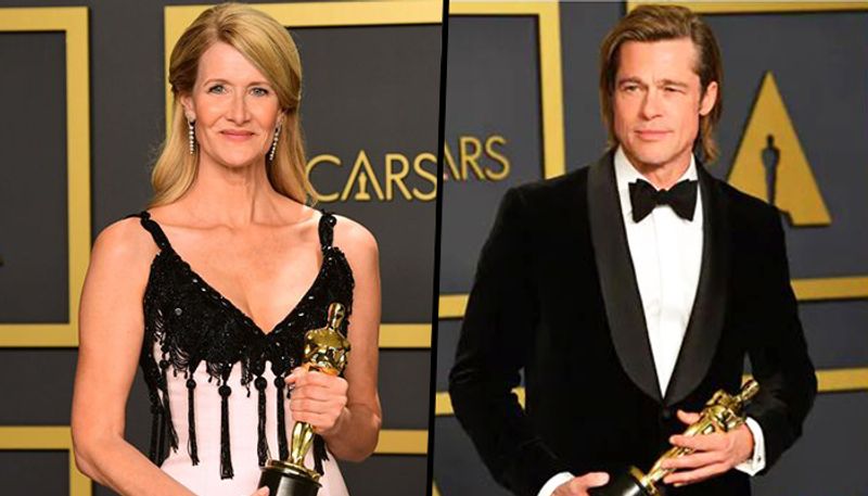 Brad Pitt and Laura Dern accept the Oscar for best supporting actor and actress