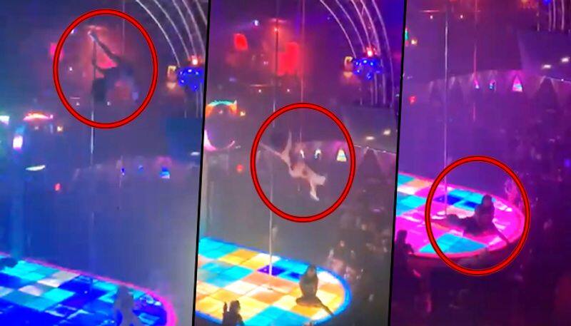 Stripper falls from 20-feet high pole and continues to perform