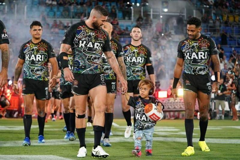 Quaden Bayles leads out Indigenous All Stars