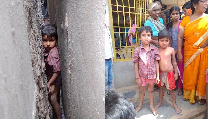 two children stuck in middle of the two walls in tadepalli