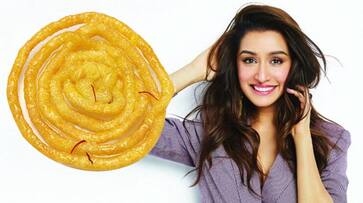 Shraddha Kapoor cant hide her glee as Tiger Shroff gifts giant jalebi on her birthday