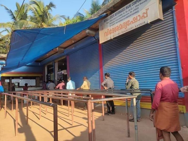 Social distancing at its best A Scene from Bevco Liqour Shop Kannur Kerala