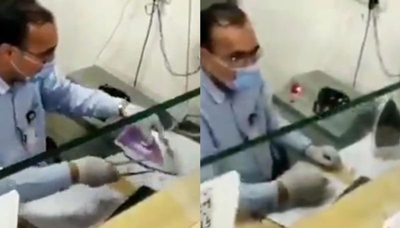 gujarat banker use steam iron to disinfect cheque