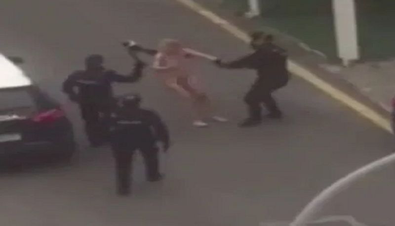 Naked woman jumps on police car after leaving court for lockdown breach