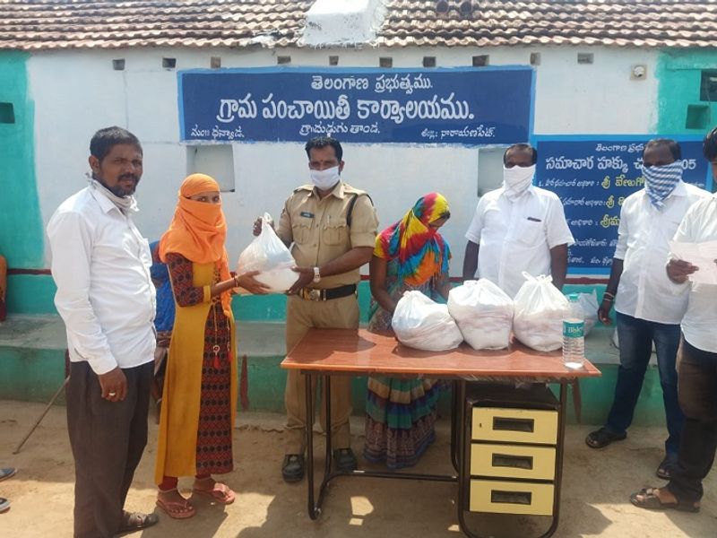 Telangana Cop adopts a village and distributes food grains during this coronavirus Outbreak