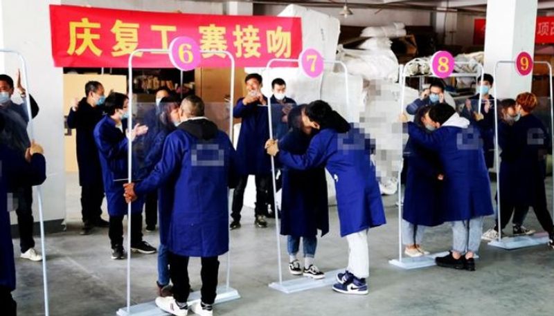 Coronavirus China factory celebrates kissing contest Twitterati slam senseless event